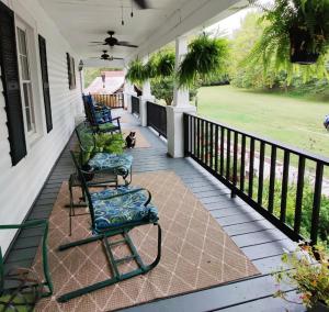 Wide porch with chairs and cat