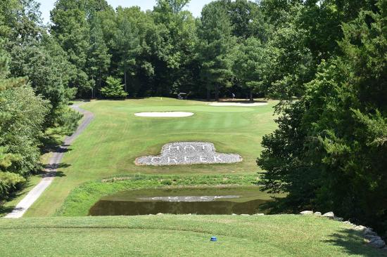 Hat shaped rock area and water hazard on par 3 at Hat Creek Golf Club