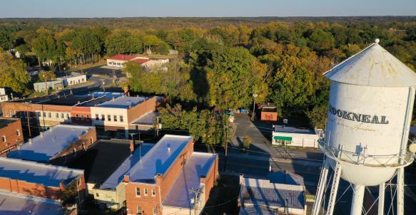 Aerial view of Brookneal water tower towering over the Main Street rooftops