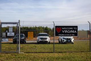 Gate and parking area with Welcome to Virginia sign