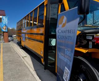 School bus and banner that reads Campbell County Schools