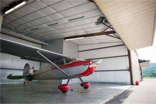 Airplane parked in hangar building